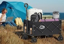a wagon with items outside an tent 