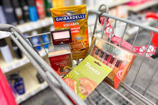maybelline eyeshadow, mix bar perfumes, ghirardelli chocolates, and a panera gift card in a cart