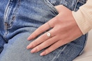 a woman wearing kiss press on nails