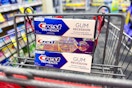 3 tubes of crest premium toothpaste in a cart