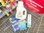 arm & hammer detergent, sensodyne kids toothpaste, listerine breath strips, and gillette disposable razors in a cart
