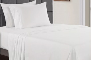 white sheets on a bed