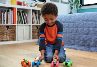 kid playing with hot wheels glow in the dark monster trucks