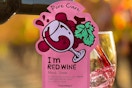 a sheet mask over a bottle of wine
