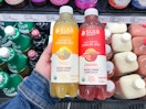 hand holding suja sparkling juice at target