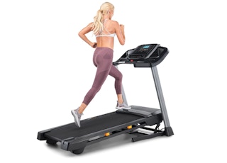 A woman running on a NordTrack T Series Treadmill
