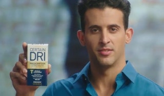 A man holding a container of Certain Dri deodorant