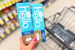 hand holding hello toothpaste in walgreens