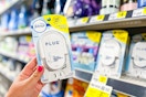 hand holding a febreze plug air freshener at dollar general