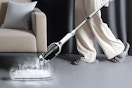a woman using a stem mop