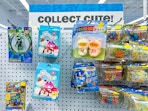 Cute collectibles hanging on a display in Five Below