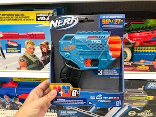 hand holding a nerf elite trio at target