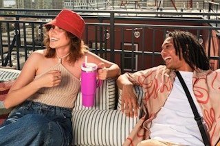 woman holding pink Stanley quencher