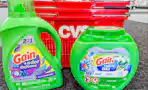 gain detergent products in front of cvs shopping basket