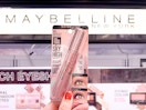 Hand holding a pack of Maybelline Sky High mascara
