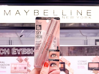 Hand holding a pack of Maybelline Sky High mascara