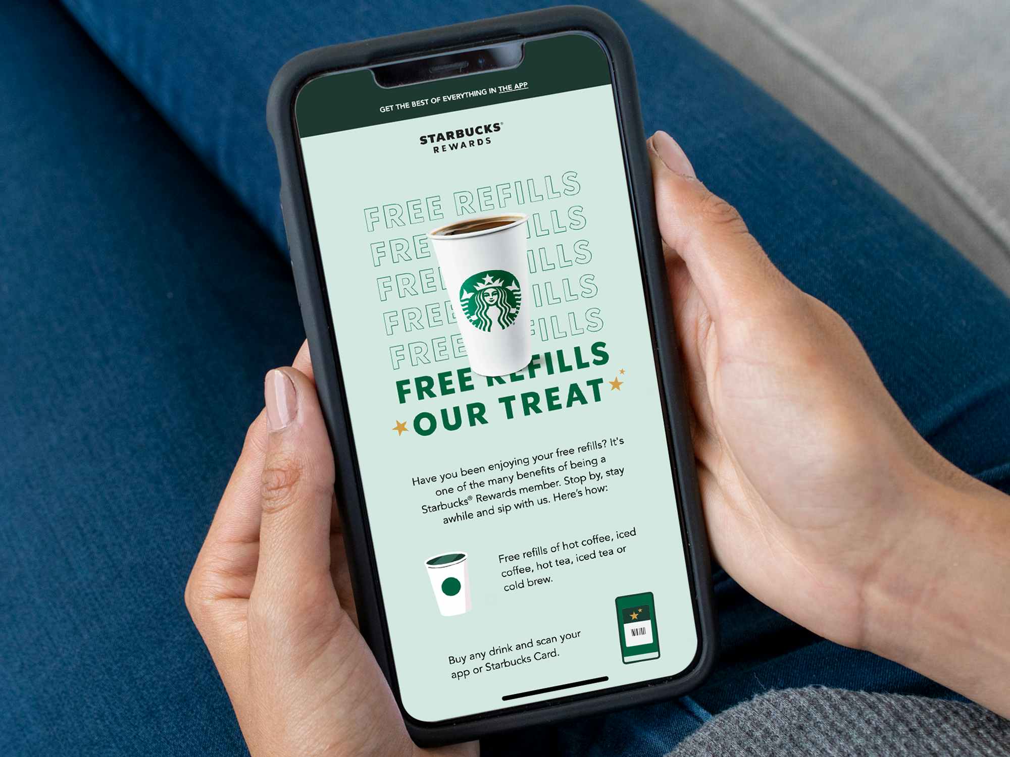 person looking at starbucks free refills email on phone