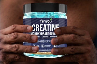 man holding creatine gummy bottle
