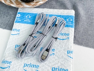 three bundles of iphone lightning charging cables on an amazon package