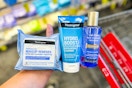 hand holding neutrogena products over a cvs cart