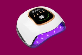 a nail lamp on a purple background