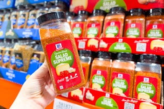 hand holding mccormick salad seasoning at costco