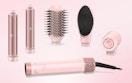 a pink hot air styler and attachments