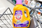 large bottle of arm and hammer laundry detergent in a cart