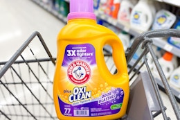 large bottle of arm and hammer laundry detergent in a cart