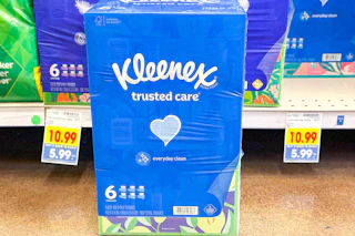 kleenex tissues in store floor in front of shelf