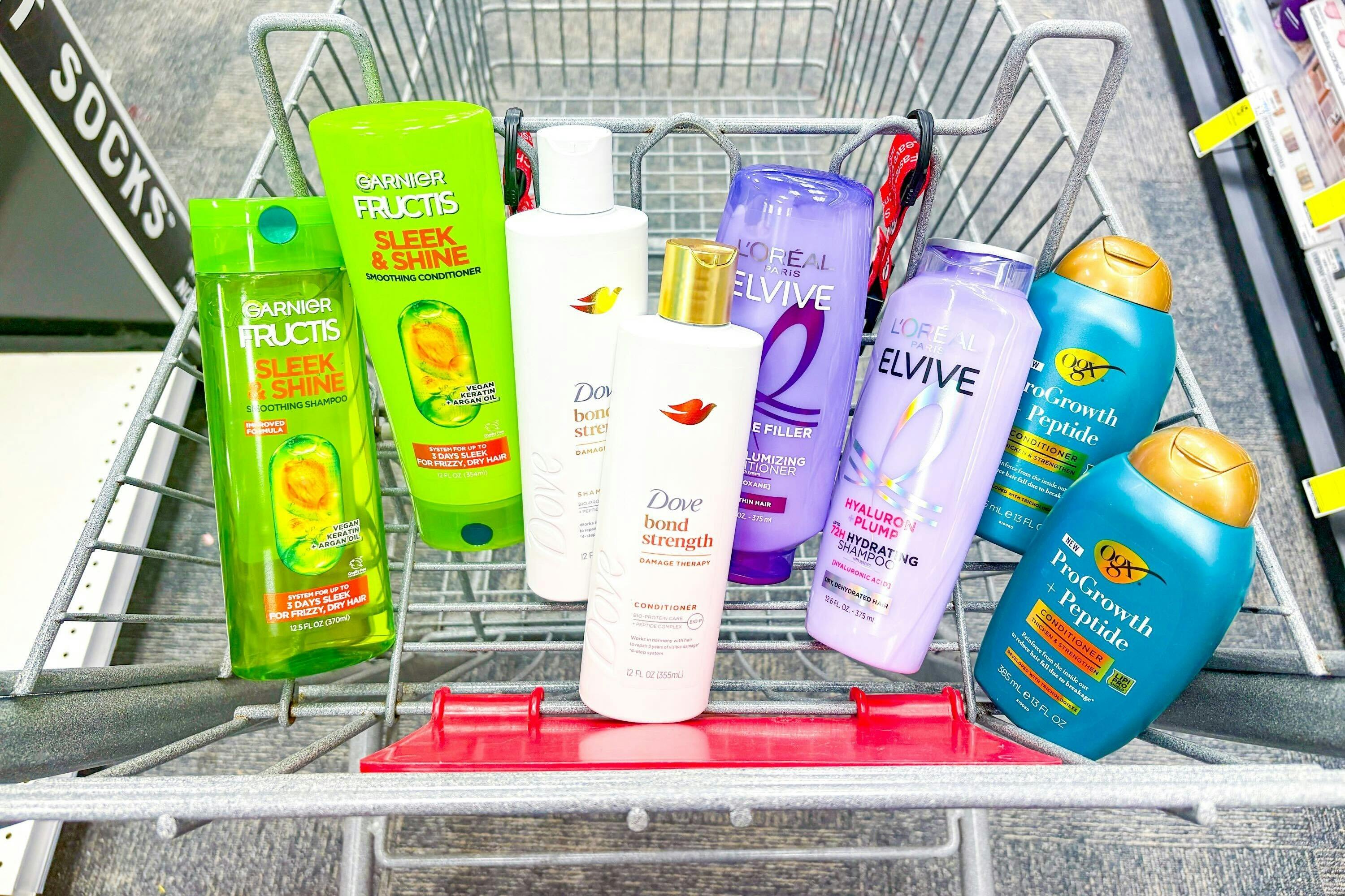 garnier, dove, loreal, and ogx shampoo in a cart