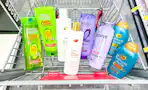garnier, dove, loreal, and ogx shampoo in a cart