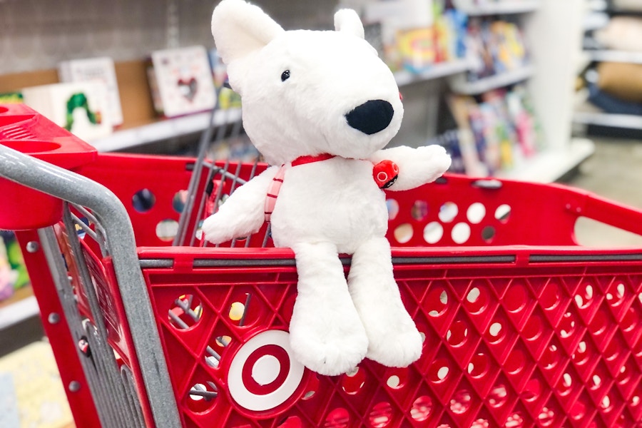 Target plush dog sitting on cart