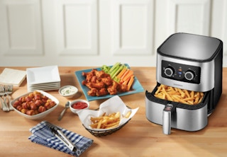 air fryer with food displayed on a table