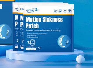 blue packs of motion sickness patches on a blue display and background