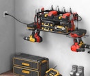 a power tool organizer with tools on the wall