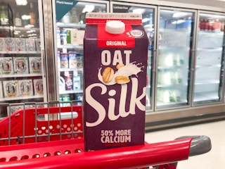 carton of oat milk in shopping cart