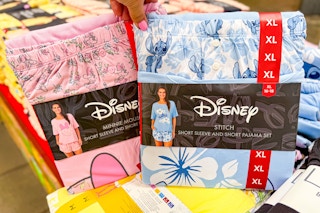 hand holding disney pajama sets