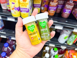 hand holding two So Good So You health shots