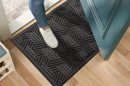 a woman using an indoor doormat