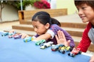 Lifestyle image of kids playing with hot wheel cars