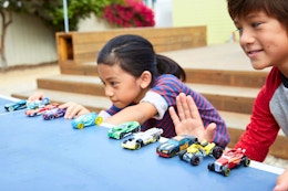 Lifestyle image of kids playing with hot wheel cars