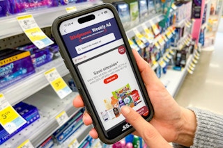 A person clicking on a deal on the Walgreen's app.