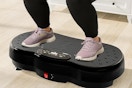 a woman on a vibration plate