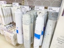 bathtub and shower mats sitting on a target shelf