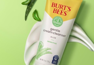 burts bees cleanser on green background