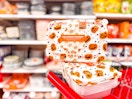 2 cook with color food container sets sitting on top a target cart
