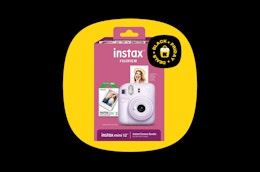 a box with an Instax camera