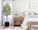 an artificial olive tree in a room