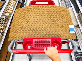embossed doormat sitting on a target cart